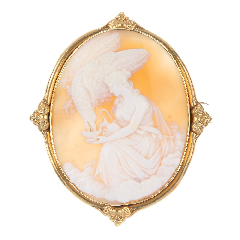 A late 19th century cameo brooch.: A late 19th century cameo brooch. The oval-shape shell, carved to depict Hebe feeding Zeus as an eagle from a bowl, within a scrolling detailed surround. Length 9.5cms. Weight 35.2gms. With case.