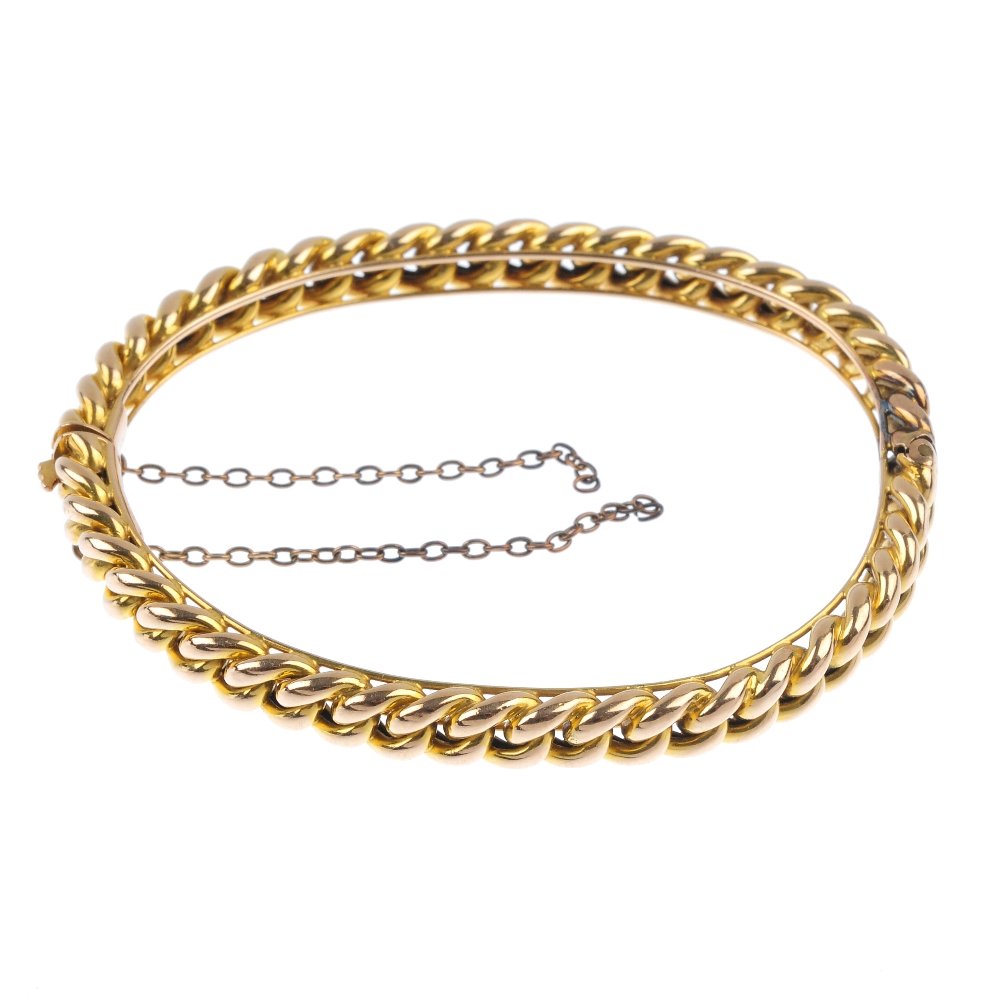An early 20th century 15ct gold hinged bangle. (1 of 3)