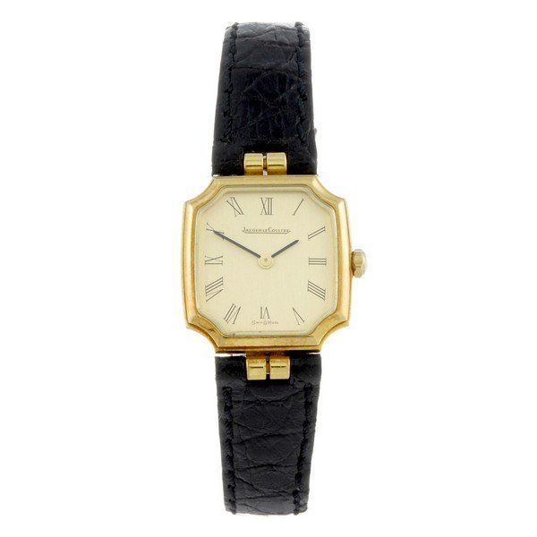 JAEGER-LECOULTRE - a lady's 18ct yellow gold wrist: JAEGER-LECOULTRE - a lady's wrist watch. 18ct yellow gold case. Reference 1400941, serial 1579743. Signed quartz movement numbered 2360353. Champagne dial with Roman numeral hour markers. Fitted to a 