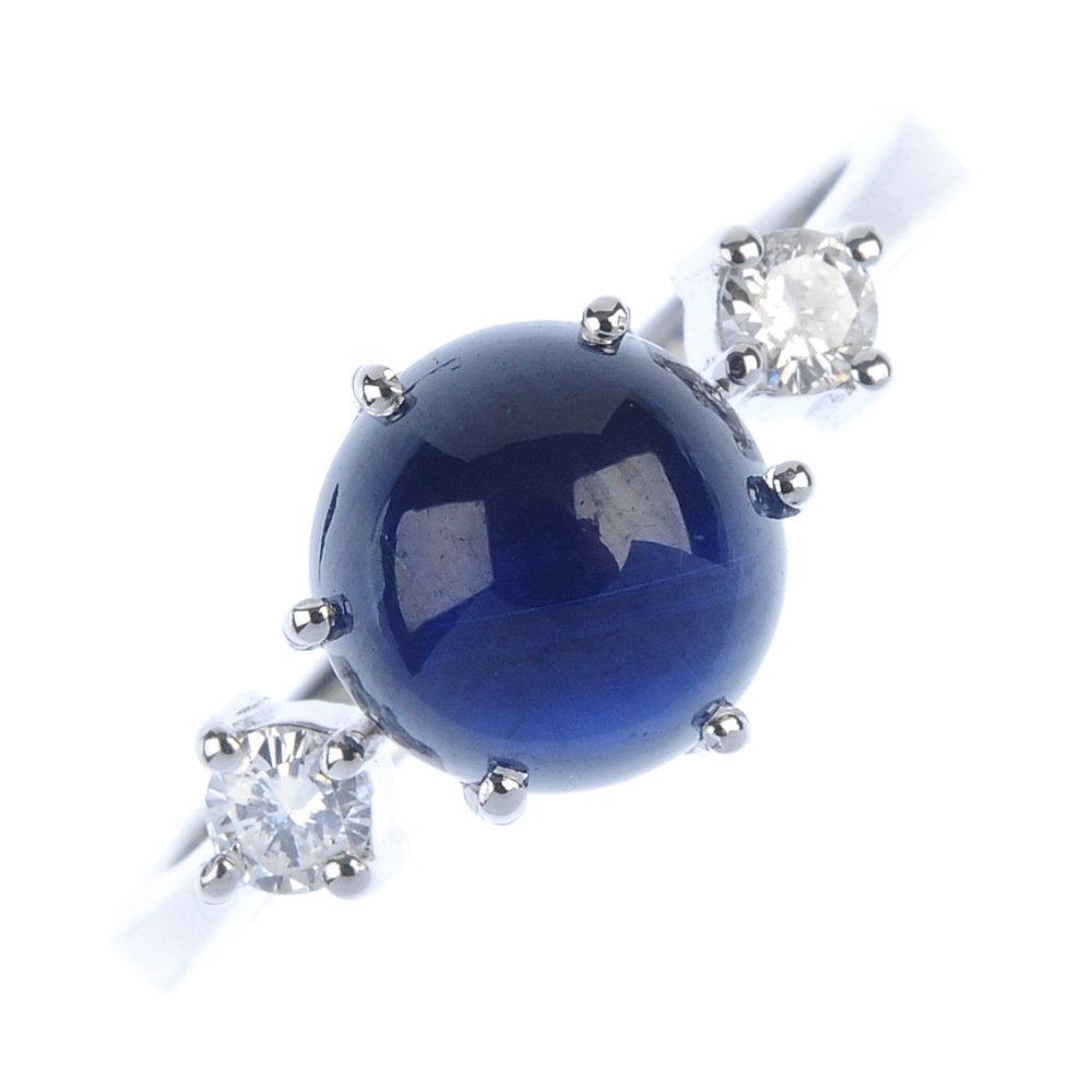 A sapphire and diamond three-stone ring. (1 of 3)