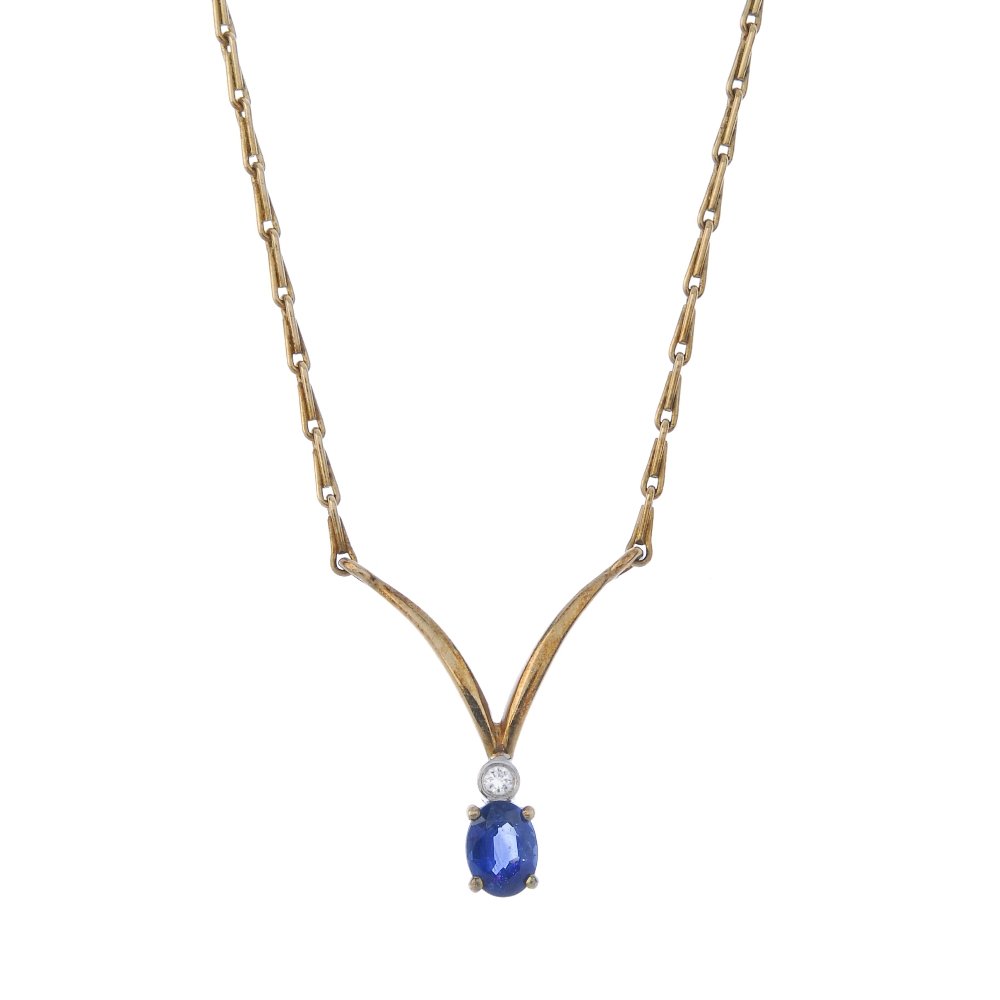 A 9ct gold sapphire and diamond pendant. (1 of 2)