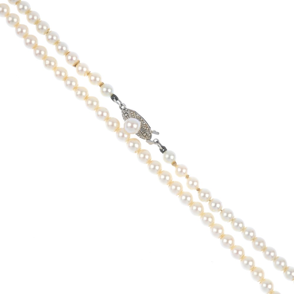 MIKIMOTO - a cultured pearl single-strand collar.: MIKIMOTO - a cultured pearl single-strand collar. Comprising eighty-two slightly graduated cultured pearls, measuring 4.4 to 4.2mms, to the similarly-set clasp. Maker's marks for Mikimoto. Length 37.5