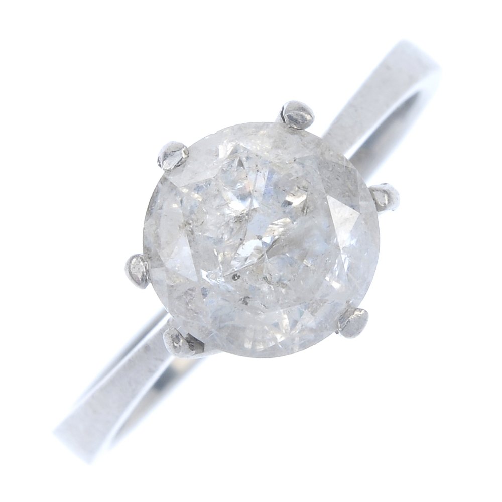 A platinum diamond single-stone ring. (1 of 3)