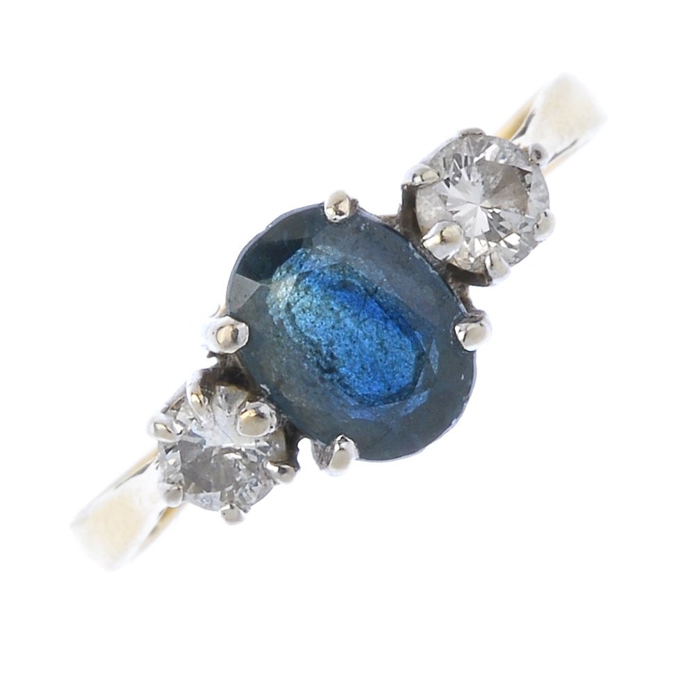 A sapphire and diamond three-stone ring. (1 of 3)