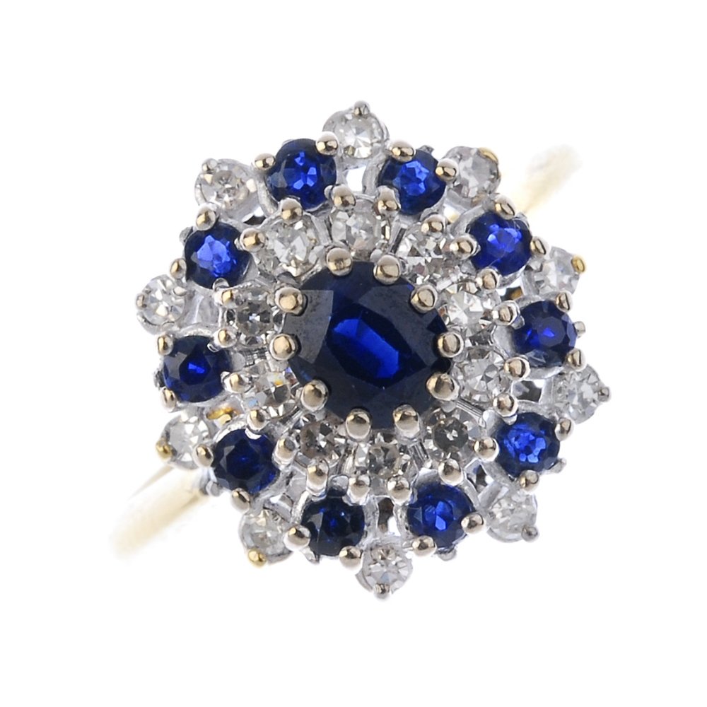 An 18ct gold sapphire and diamond cluster ring. (1 of 3)