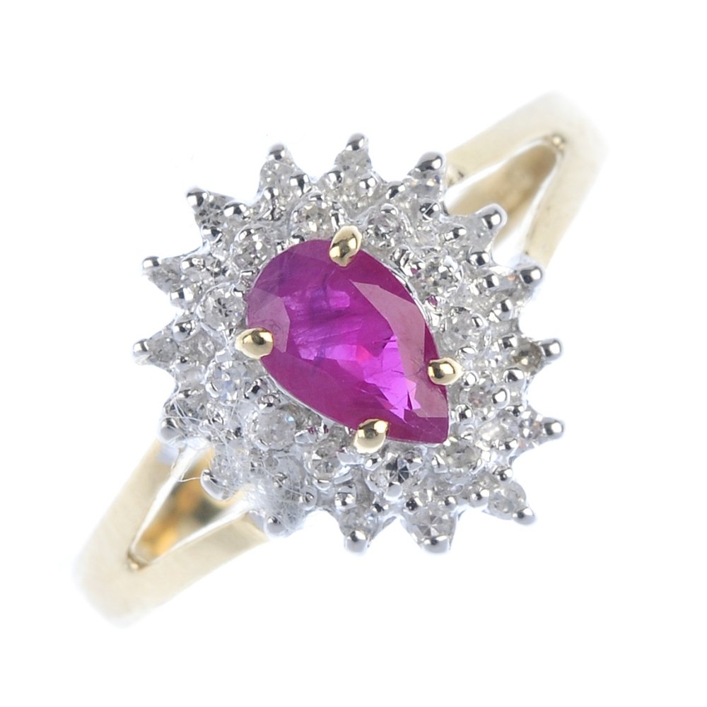 A 9ct gold ruby and diamond cluster ring. (1 of 4)