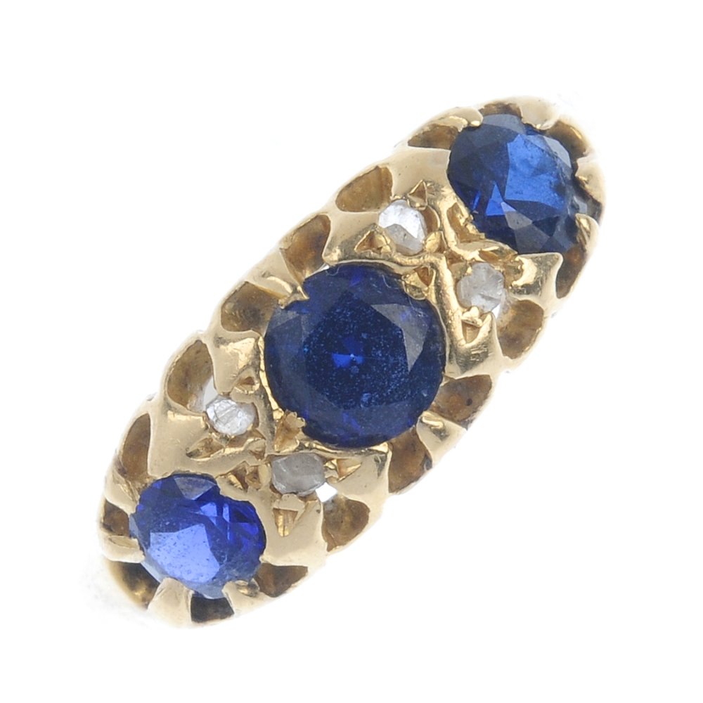 An Edwardian 18ct gold sapphire and diamond ring. (1 of 2)