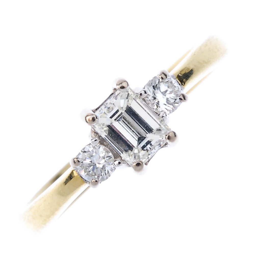 An 18ct gold diamond three-stone ring. (1 of 4)