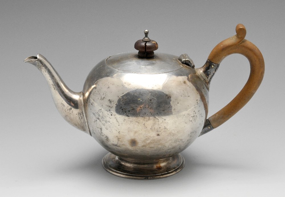A late Victorian silver teapot, plus a selection of: A late Victorian silver teapot of globular form having scroll capped wooden handle raised upon footed base, hallmarked Charles Stuart Harris, London 1896, height measures 5 inches (12.75 cm). Together