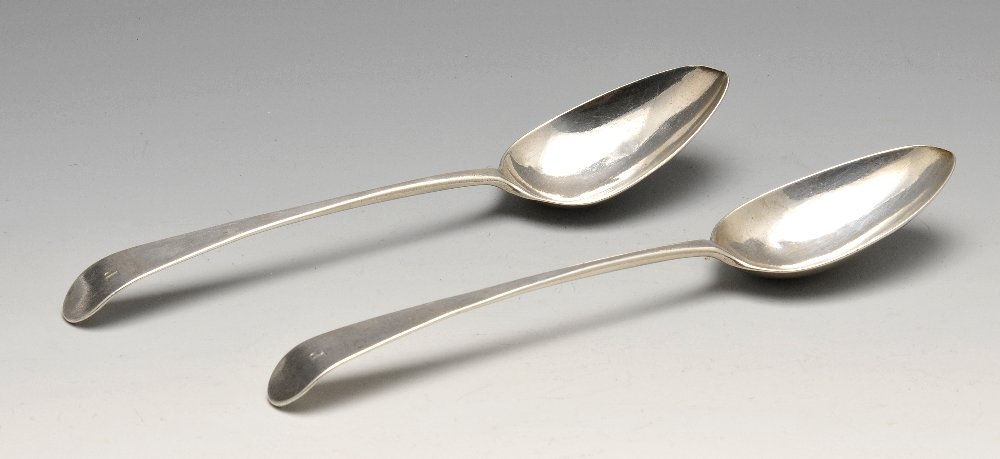A pair of George III Old English pattern silver table: A pair of George III Old English pattern silver table spoons with initialled terminal and extended drop to the heel. Hallmarked George Gray, London 1788. Length measuring 8 1/4 inches (21 cm), gross w