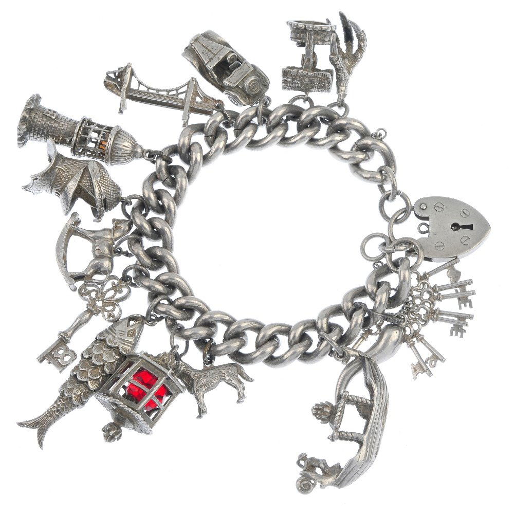 Two charm bracelets.: Two charm bracelets. The two curb-link bracelets suspending forty-seven charms to include a seagull and a bell charms. (47) Weight 215gms.