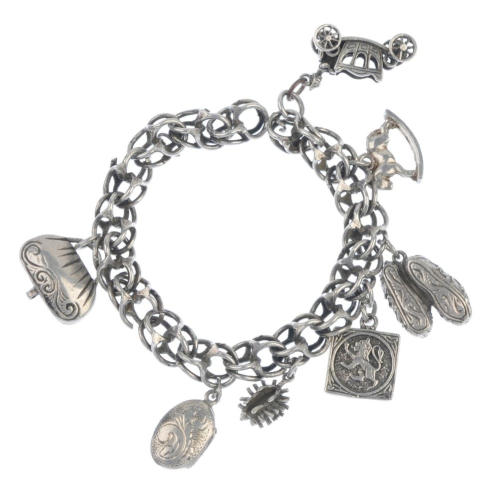 A selection of charms and broken charm bracelets.: A selection of charms and broken charm bracelets. To include seventy-five charms and several pieces of broken chain, together with a necklace. Weight 302.5gms.