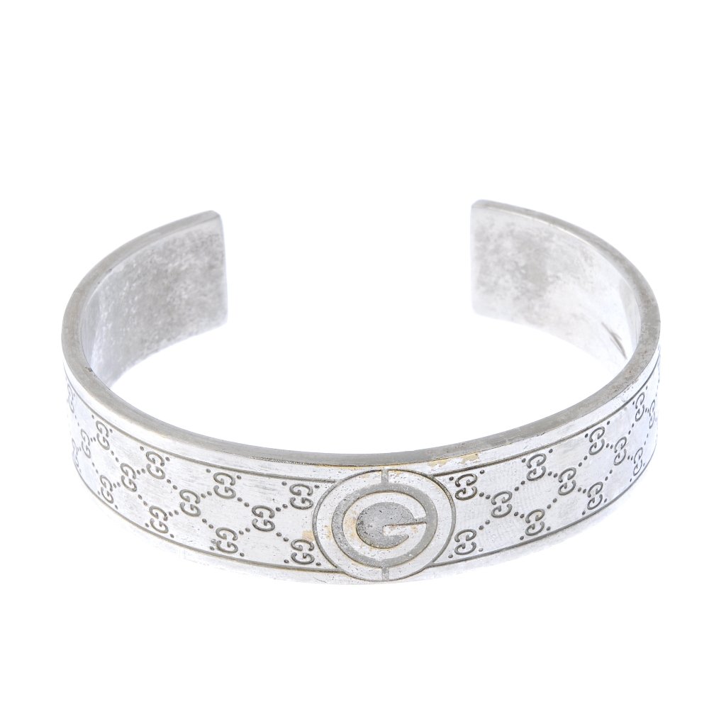 GUCCI - a bangle and a pair of cufflinks. (1 of 4)