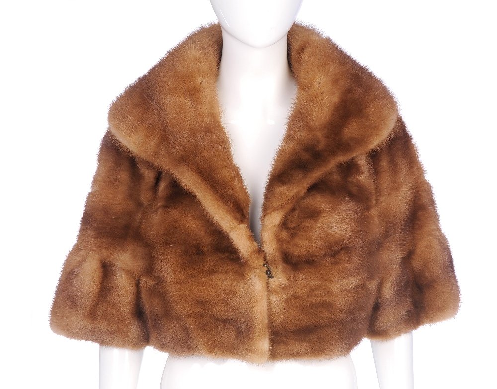 A pastel mink bolero.: A pastel mink bolero. Designed with a cape collar, single hook and eye front fastening and cropped sleeves. Believed to be a size 12.