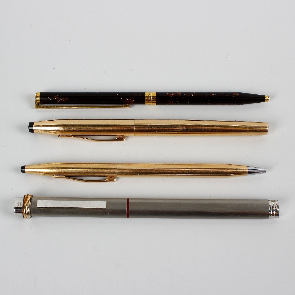 A selection of various pens, to include a Cartier: A selection of various pens, to include a Cartier brushed steel rollerball, a Dupont gold plated Laque de Chine ballpoint and a Cross gold plated fountain pen and ballpoint set in case.