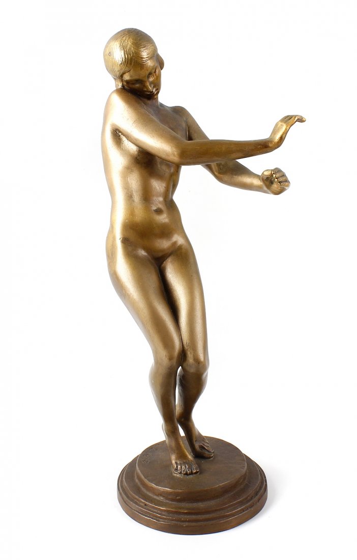 A 20th century bronze figure.: A 20th century bronze figure. Modelled as a dancing female nude, upon stepped circular base inscribed 'H.K. Scholz 1919', 13" (33 cm) high.