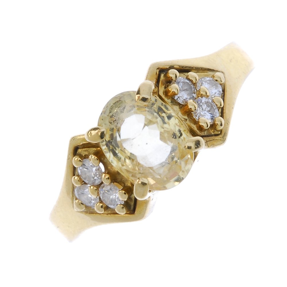 An 18ct gold sapphire and diamond dress ring. (1 of 3)