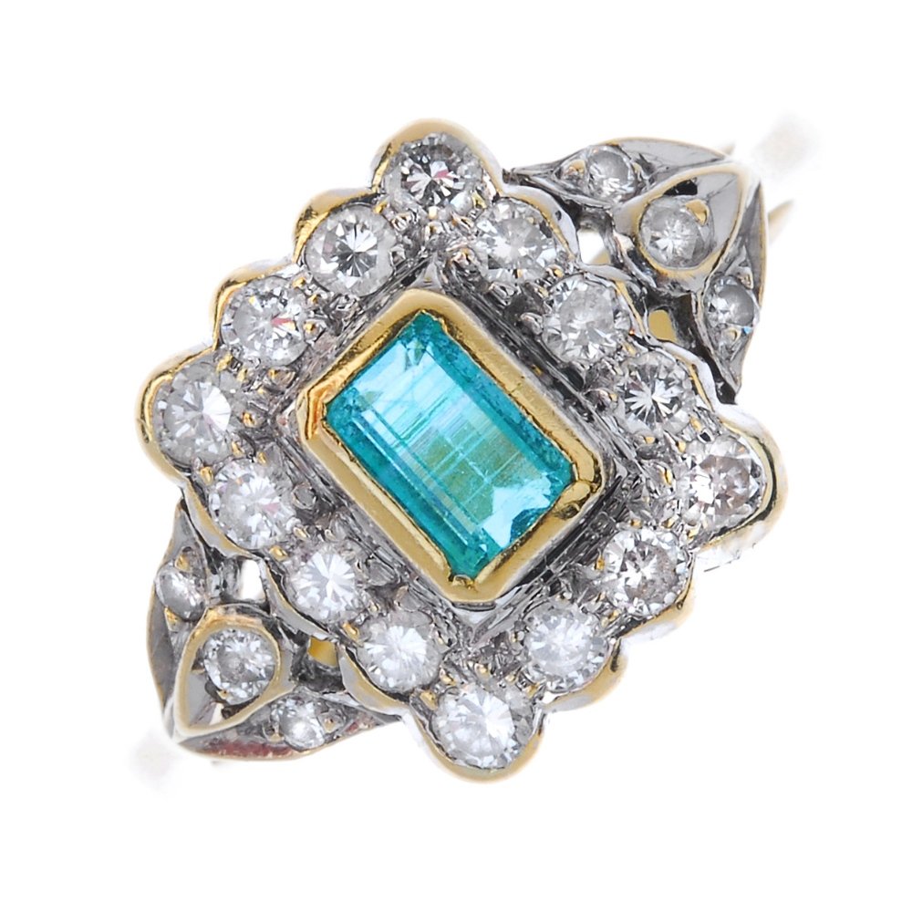 An 18ct gold emerald and diamond cluster ring. (1 of 4)