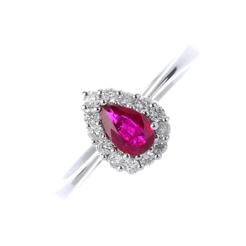 An 18ct gold ruby and diamond cluster ring. (1 of 3)