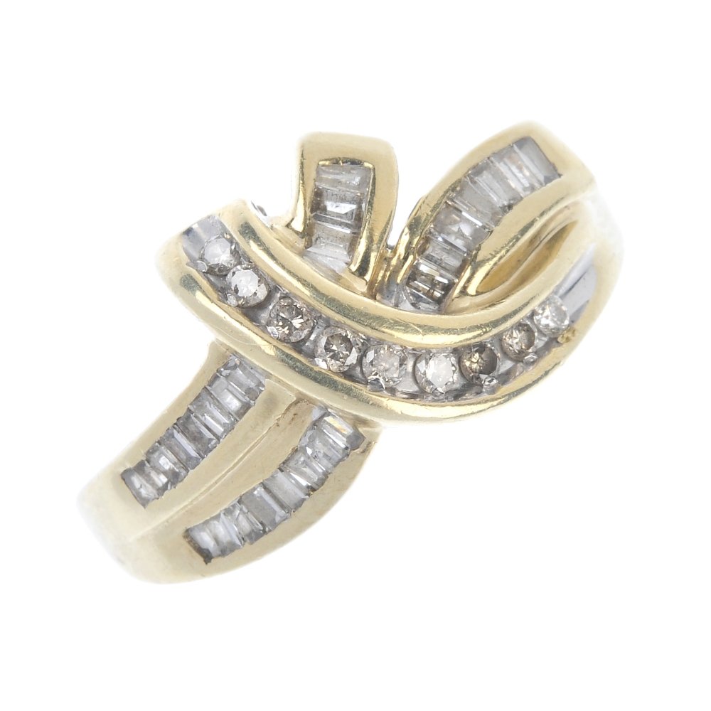 A 9ct gold diamond dress ring. (1 of 4)