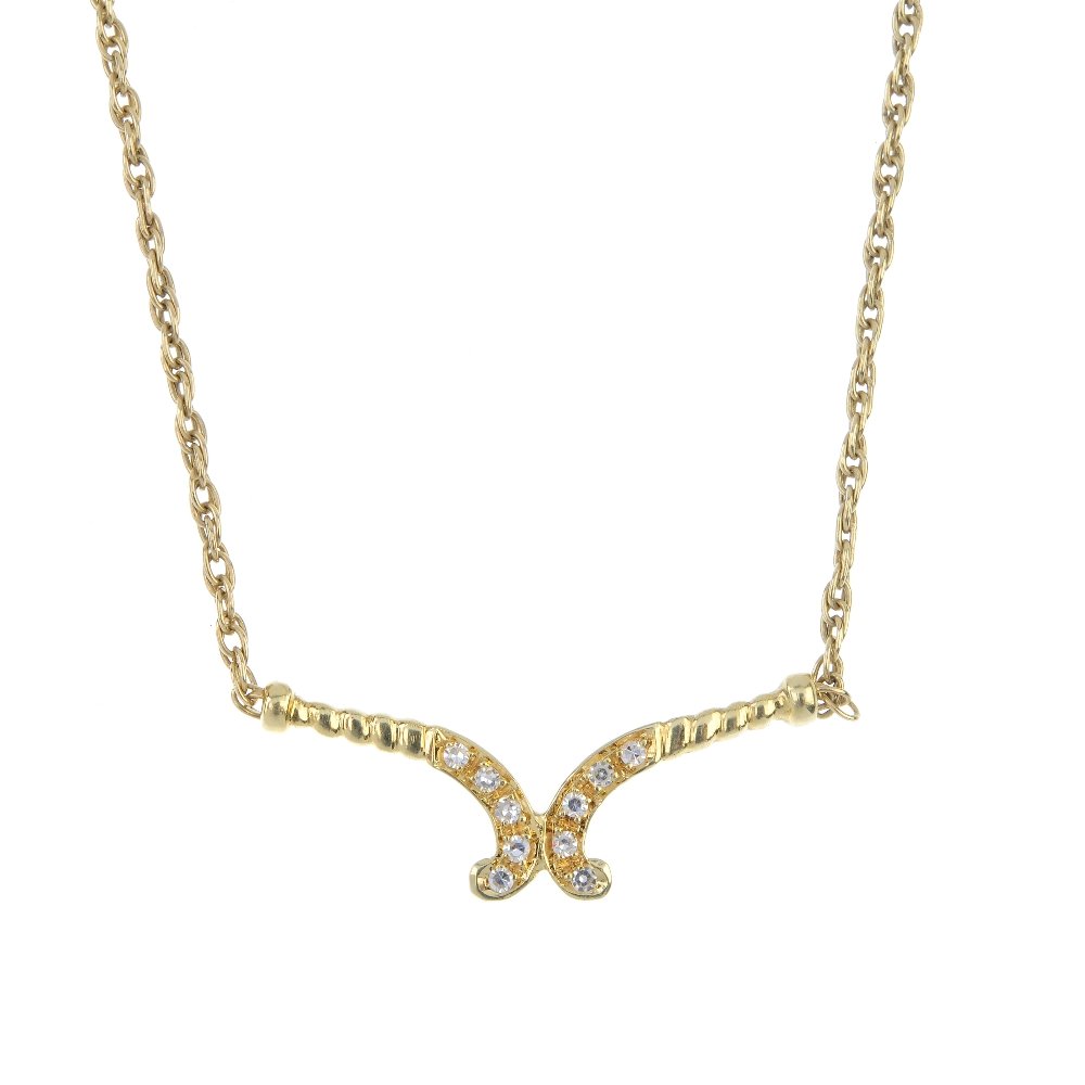 An 18ct gold diamond pendant. (1 of 2)