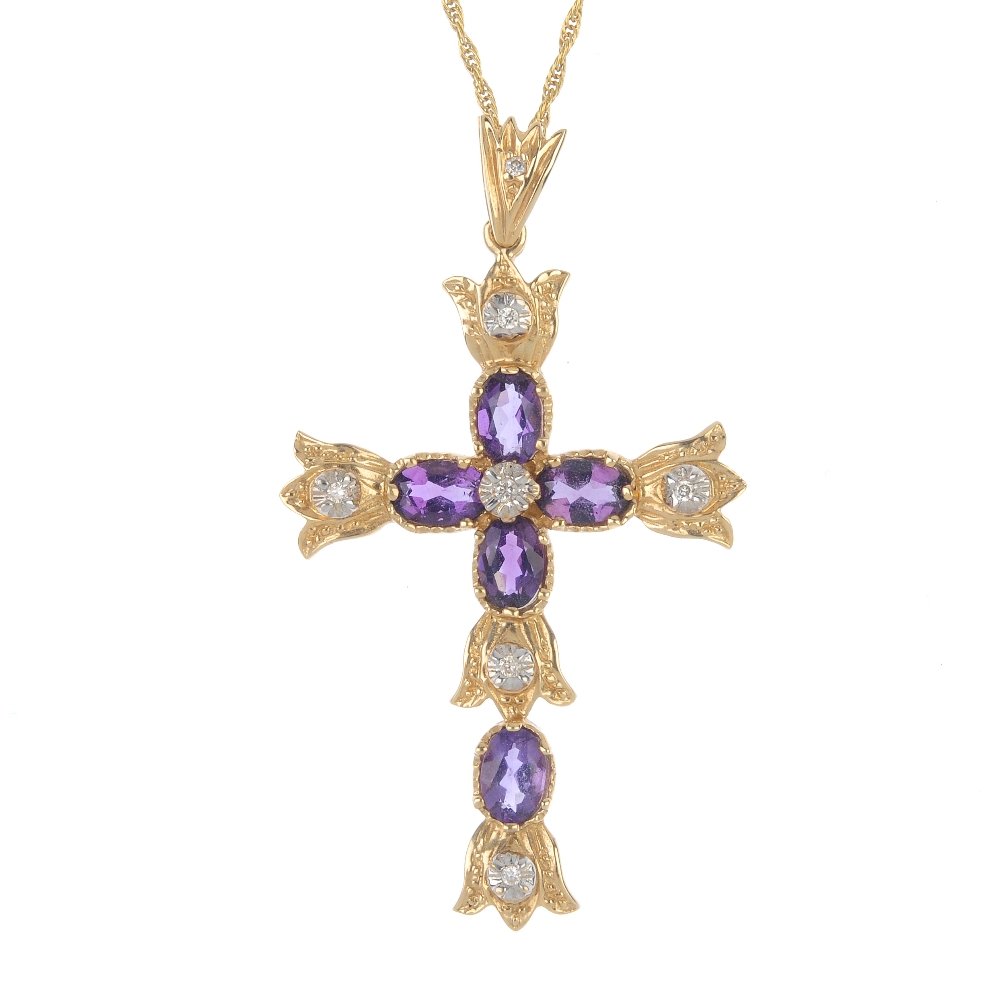 A 14ct gold amethyst and diamond cross pendant. (1 of 2)