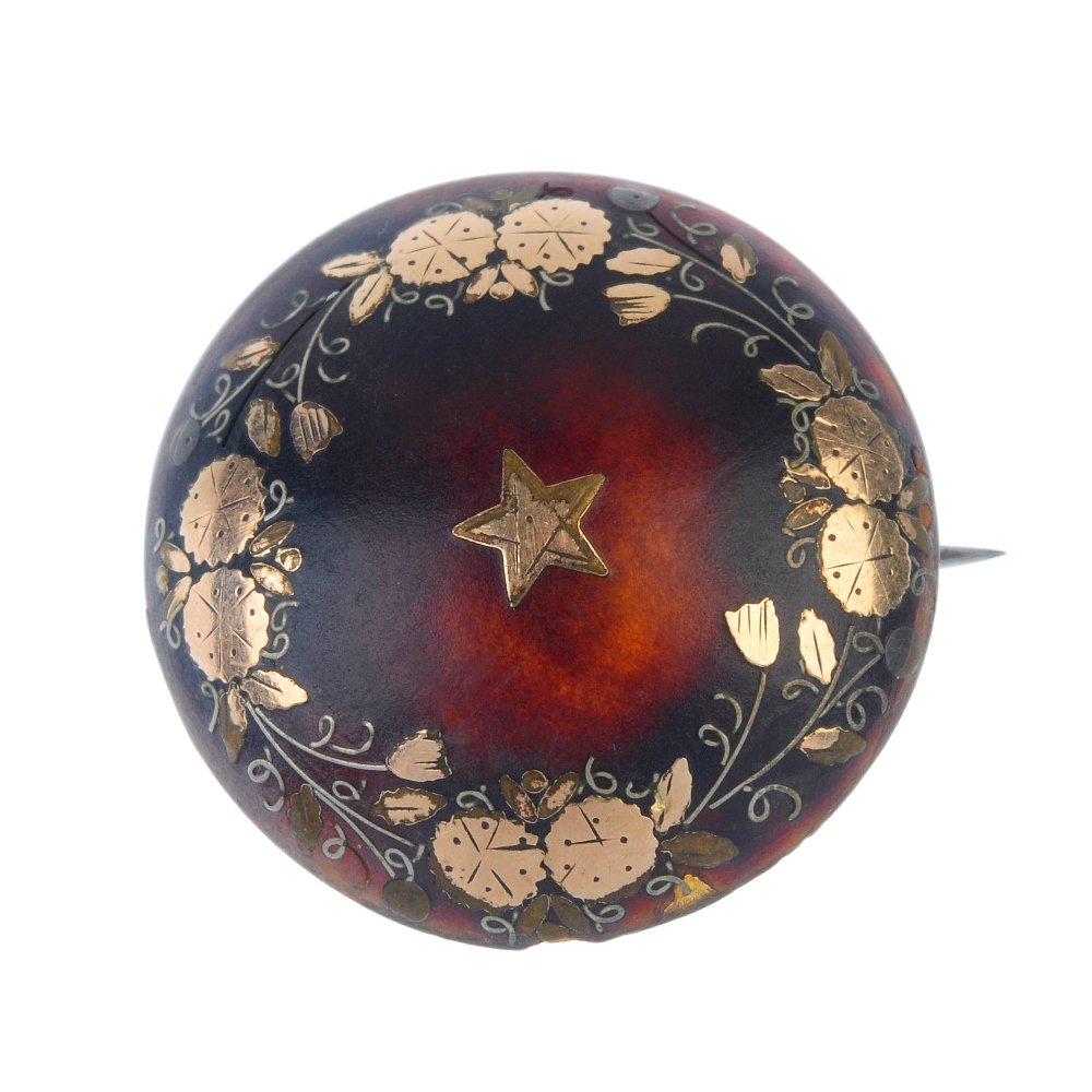 A late 19th century tortoiseshell pique brooch. (1 of 2)