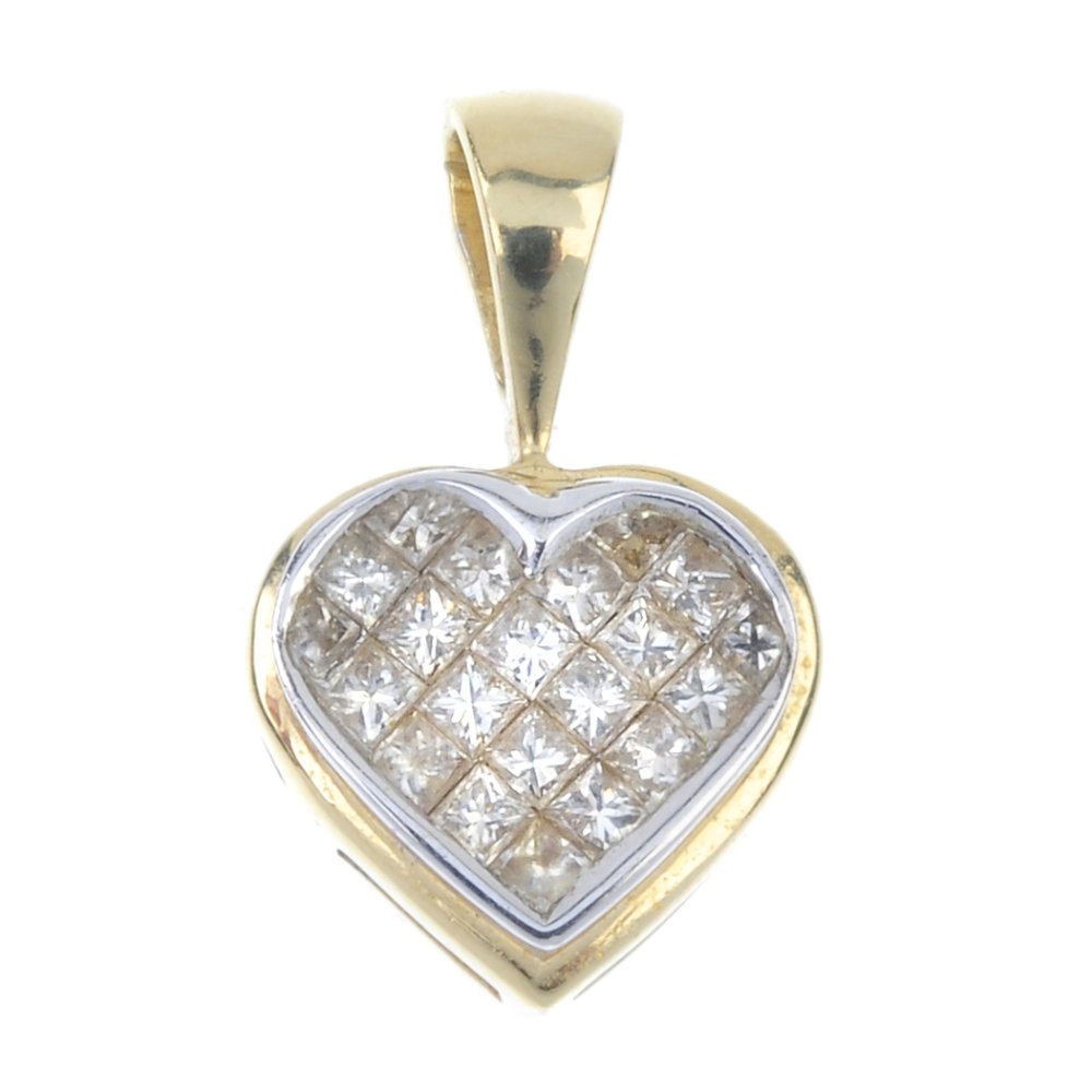 An 18ct gold diamond pendant. (1 of 2)