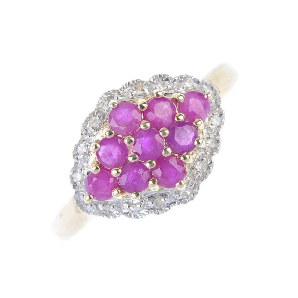 A 9ct gold ruby and diamond dress ring. (1 of 3)