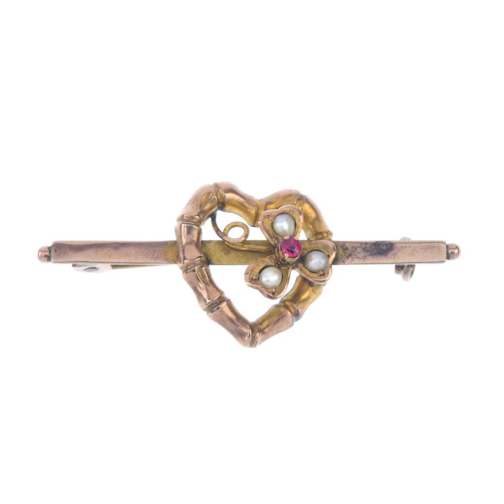 An Edwardian 9ct gold split pearl and ruby brooch. (1 of 2)