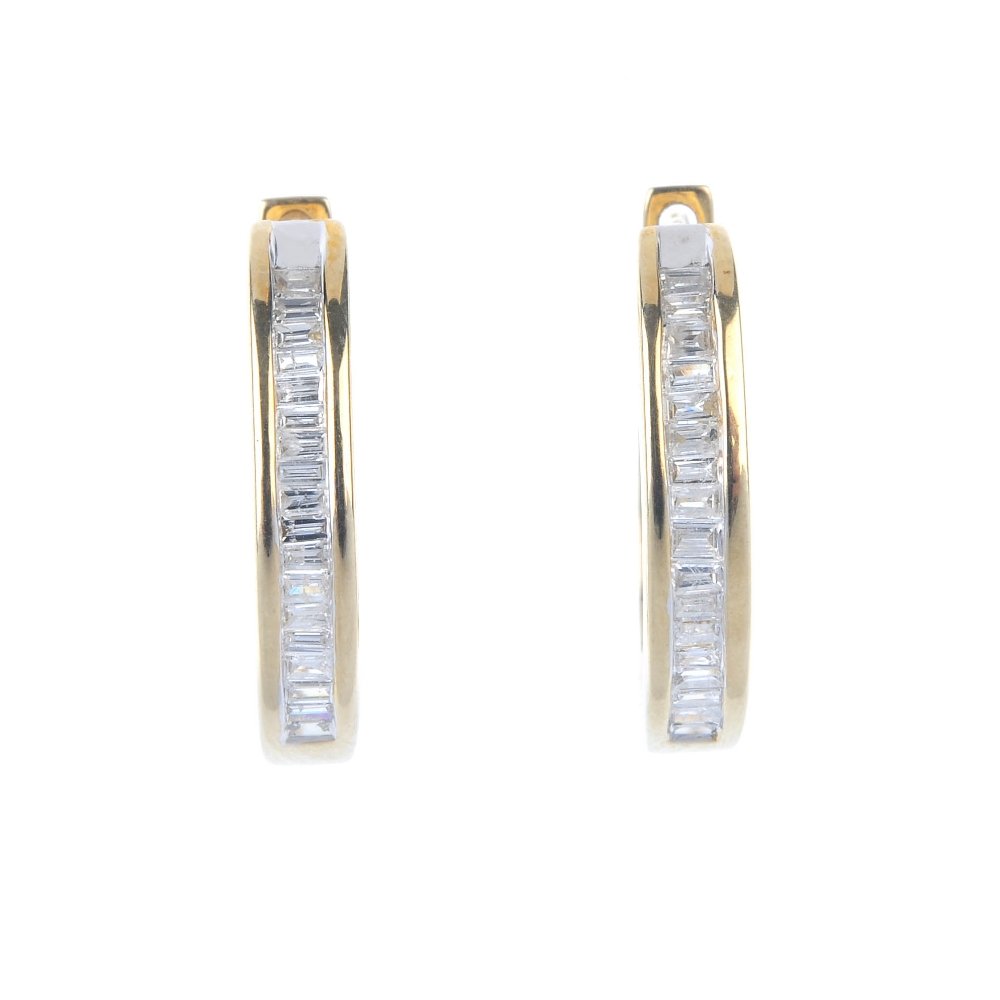 A pair of 9ct gold diamond hinged ear hoops. (1 of 2)