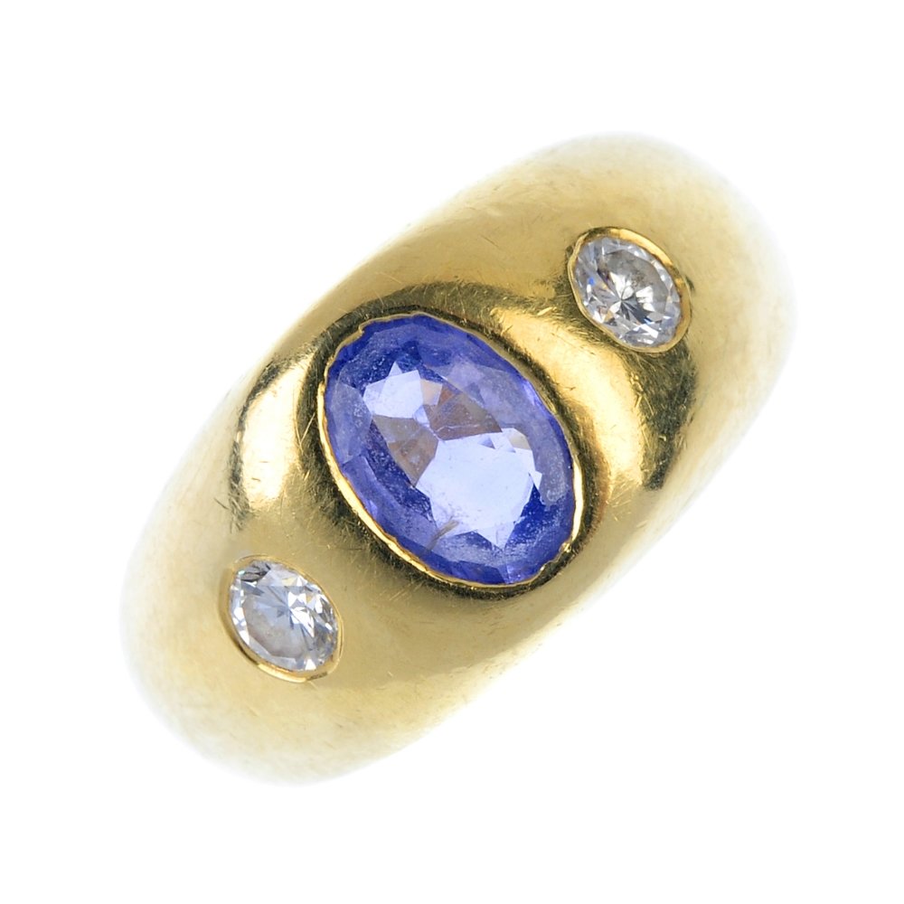 A sapphire and diamond three-stone ring. (1 of 3)