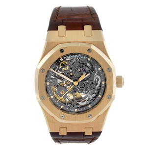 CURRENT MODEL: AUDEMARS PIGUET - a gentleman's 18ct: CURRENT MODEL: AUDEMARS PIGUET - a gentleman's Royal Oak Openworked wrist watch. 18ct rose gold case with exhibition case back. Reference 15305OR.00.D088CR.01, serial H87511. Numbered 317. Signed skel