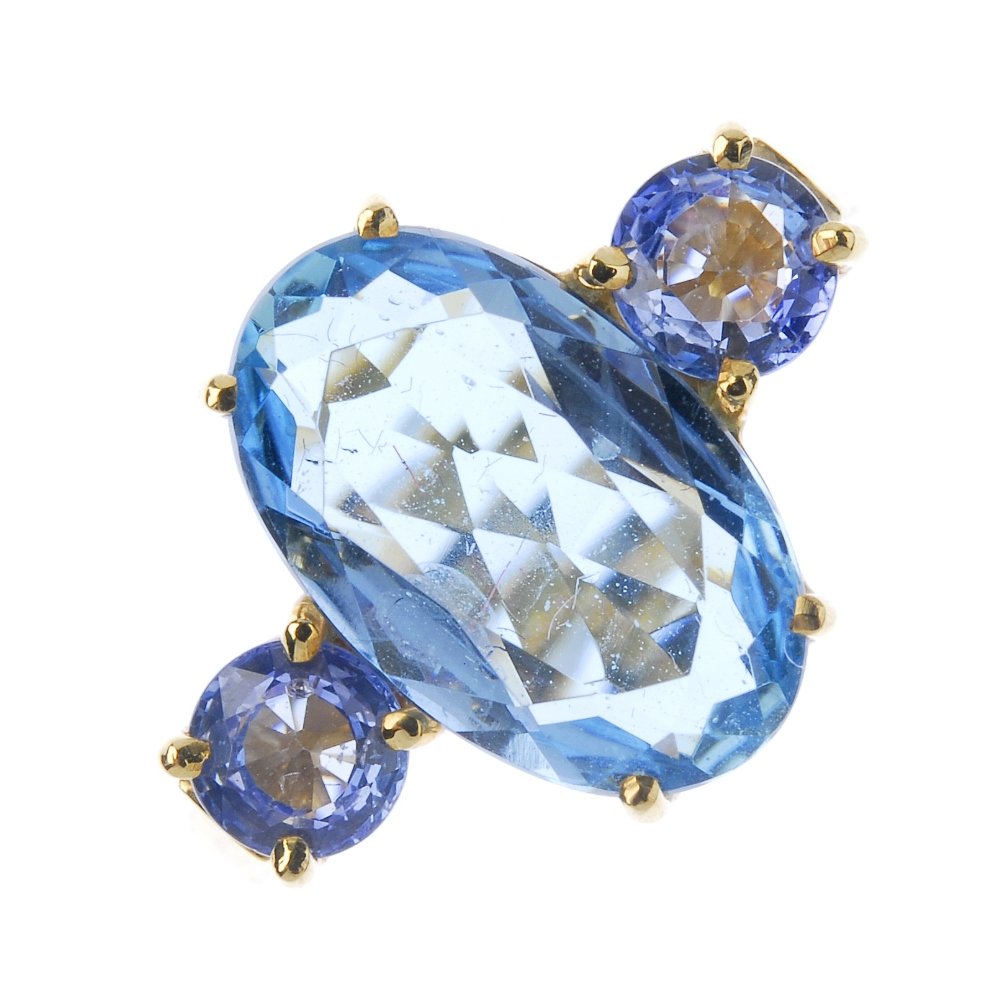 An 18ct gold aquamarine and sapphire three-stone ring. (1 of 3)