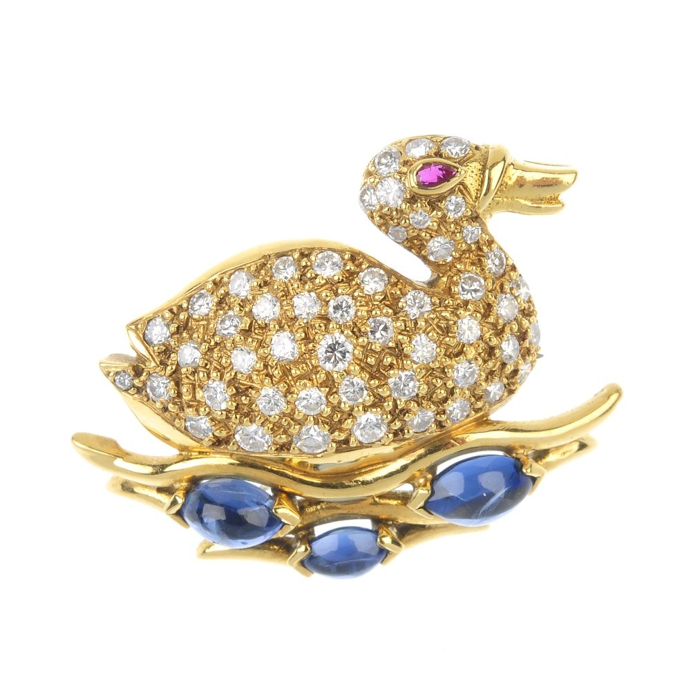 An 18ct gold diamond, sapphire and ruby duck brooch. (1 of 2)