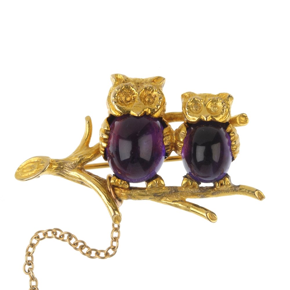 A 9ct gold amethyst owl brooch. (1 of 3)