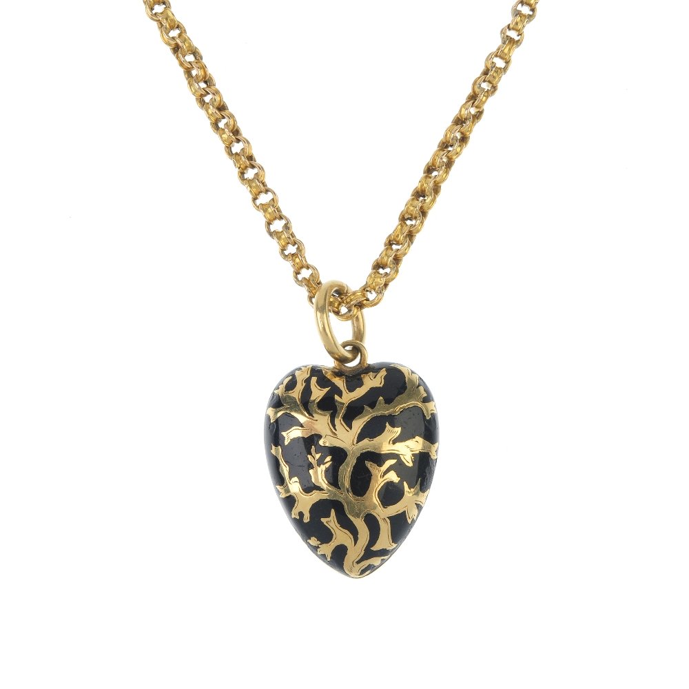 A mid Victorian gold black enamel pendant and chain. (1 of 3)