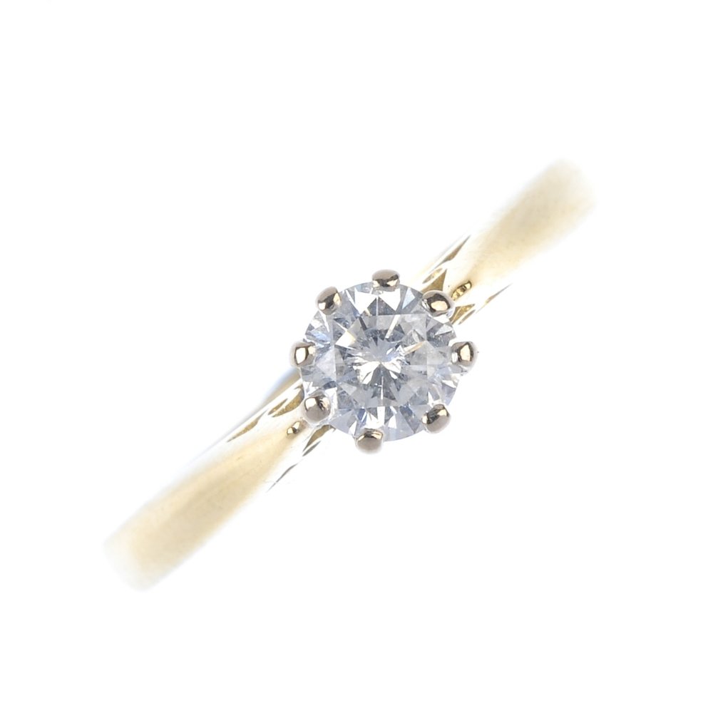 An 18ct gold diamond single-stone ring. The (1 of 3)