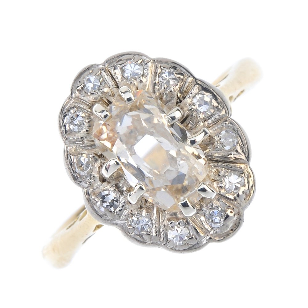 A diamond cluster ring. The oval-shape diamond, within (1 of 3)