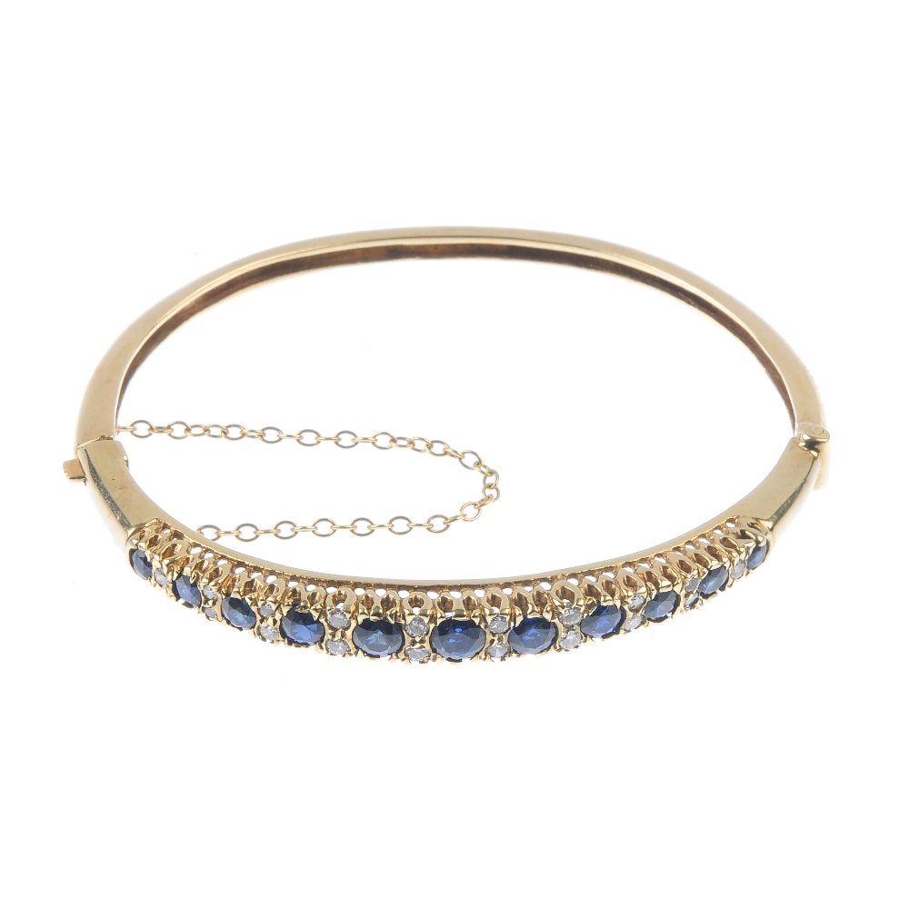 A sapphire and diamond hinged bangle. Comprising a (1 of 3)