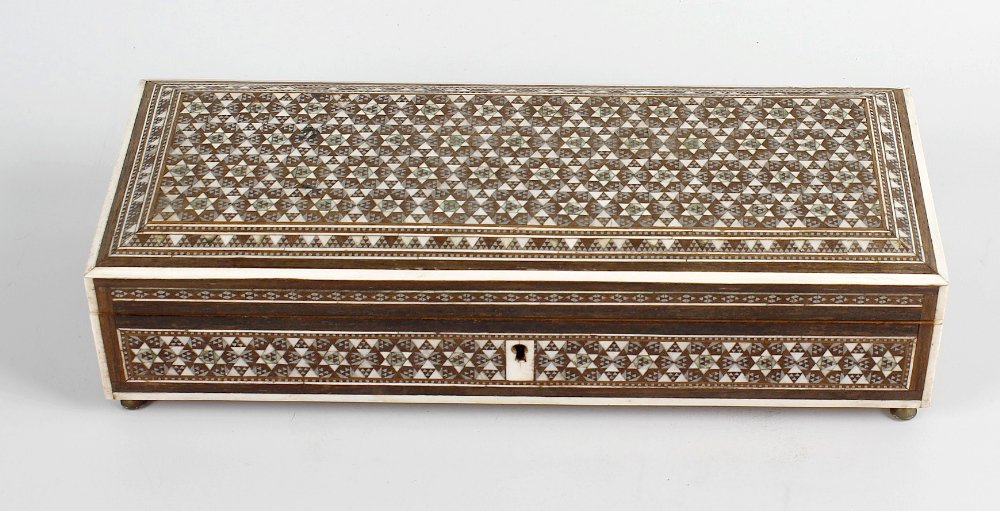 An Anglo Indian sadeli glove box, of rectangular form: An Anglo Indian sadeli glove box, of rectangular form decorated to the whole with inlaid and interlocking star pattern, the hinged cover opening to reveal a vacant lined interior and the whole raised 