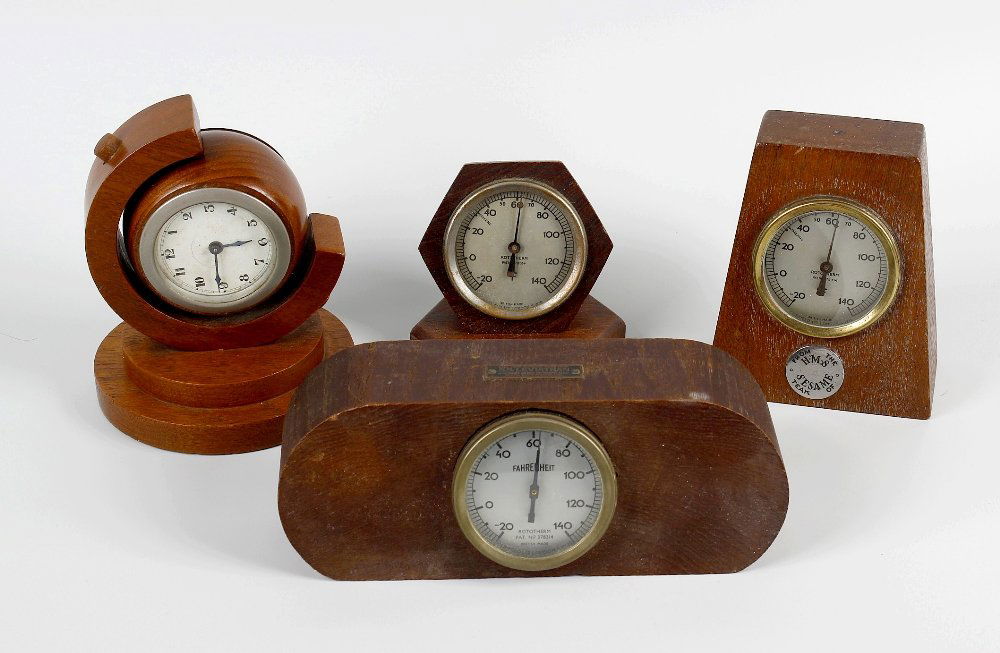 Shipbreakers timber. Three shaped wooden desk: Shipbreakers timber. Three shaped wooden desk thermometers, together with a similar desk clock, each with applied metal plaque of name of ship, S. S. Leviathan, H. M. S. Sesame, H. M. S. Spartiate, H.