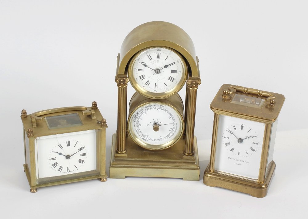A late 19th century combined desk clock and barometer,: A late 19th century combined desk clock and barometer, the arched brass case with column detail (mechanism altered), a Matthew Norman carriage clock, etc.