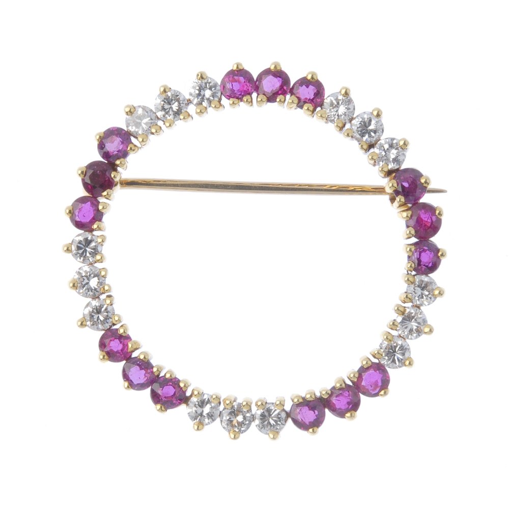 An 18ct gold diamond and ruby wreath brooch. Comprising (1 of 2)