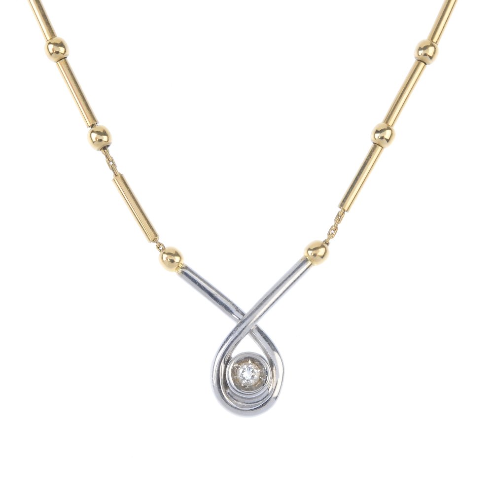 An 18ct gold diamond single-stone necklace. The (1 of 2)