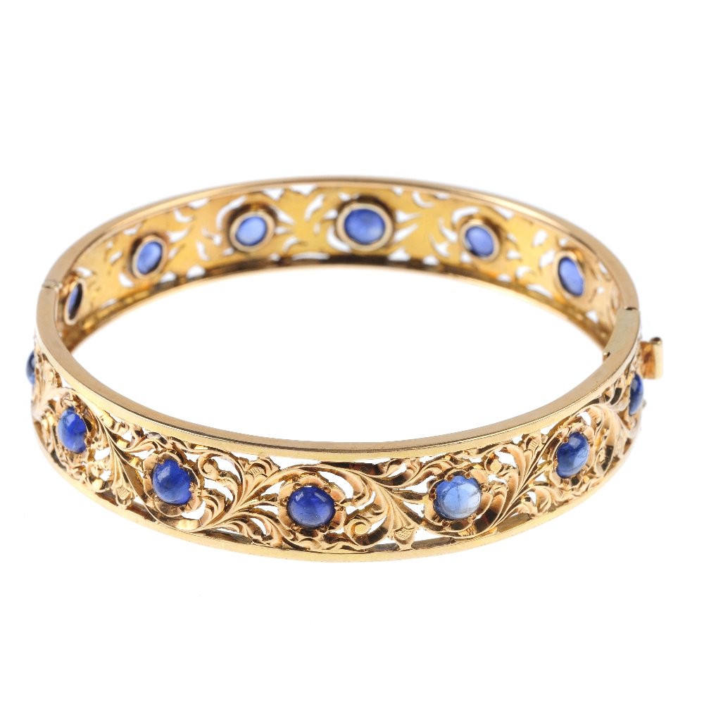 A sapphire hinged bangle. Designed as a series of (1 of 3)