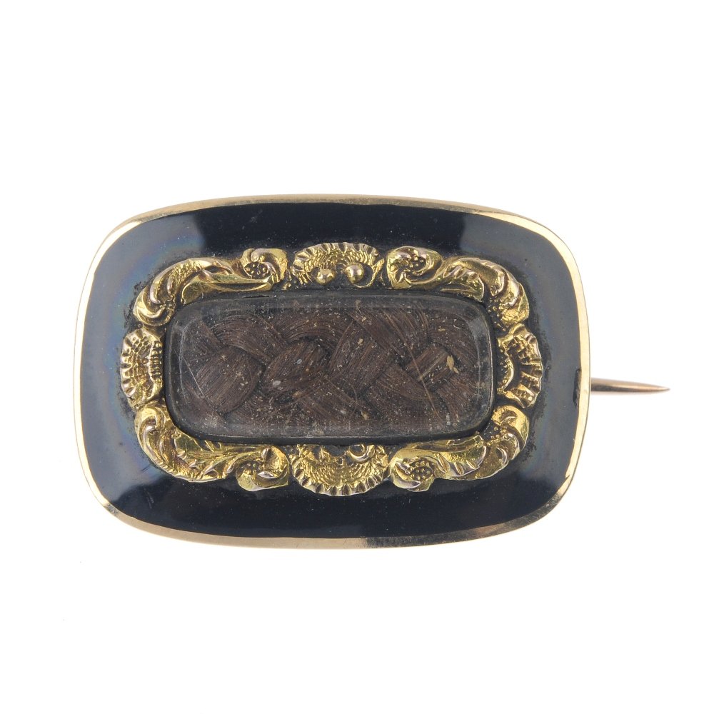 An early 19th century enamel mourning brooch. The woven (1 of 2)