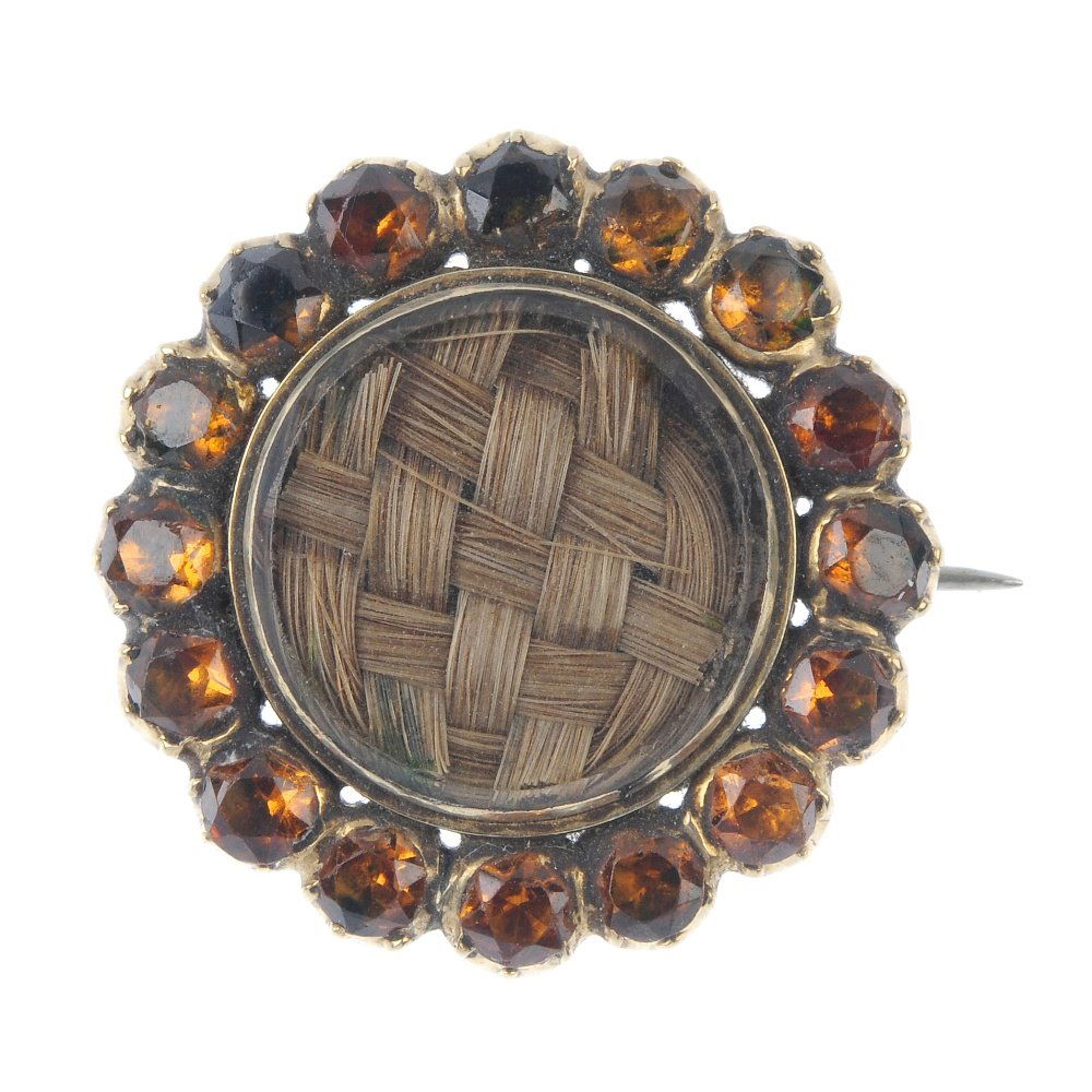 A mid 19th century gem-set mourning brooch.  Of (1 of 2)