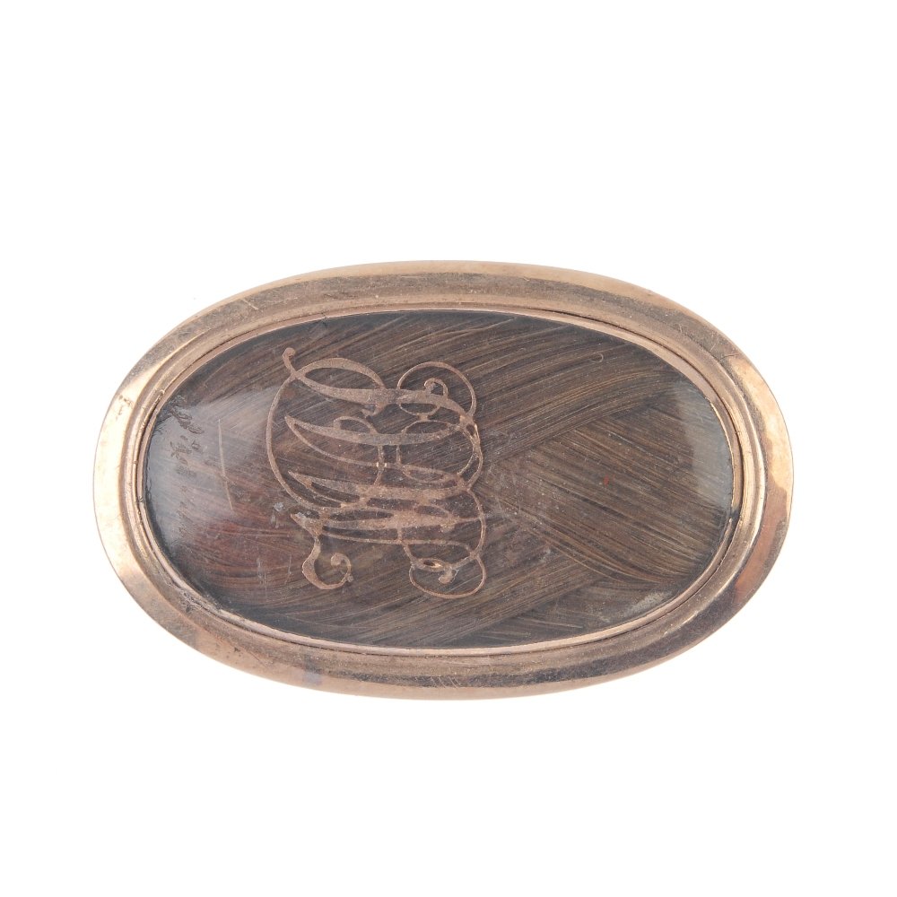 A late 18th century 9ct gold mourning brooch. Of (1 of 2)