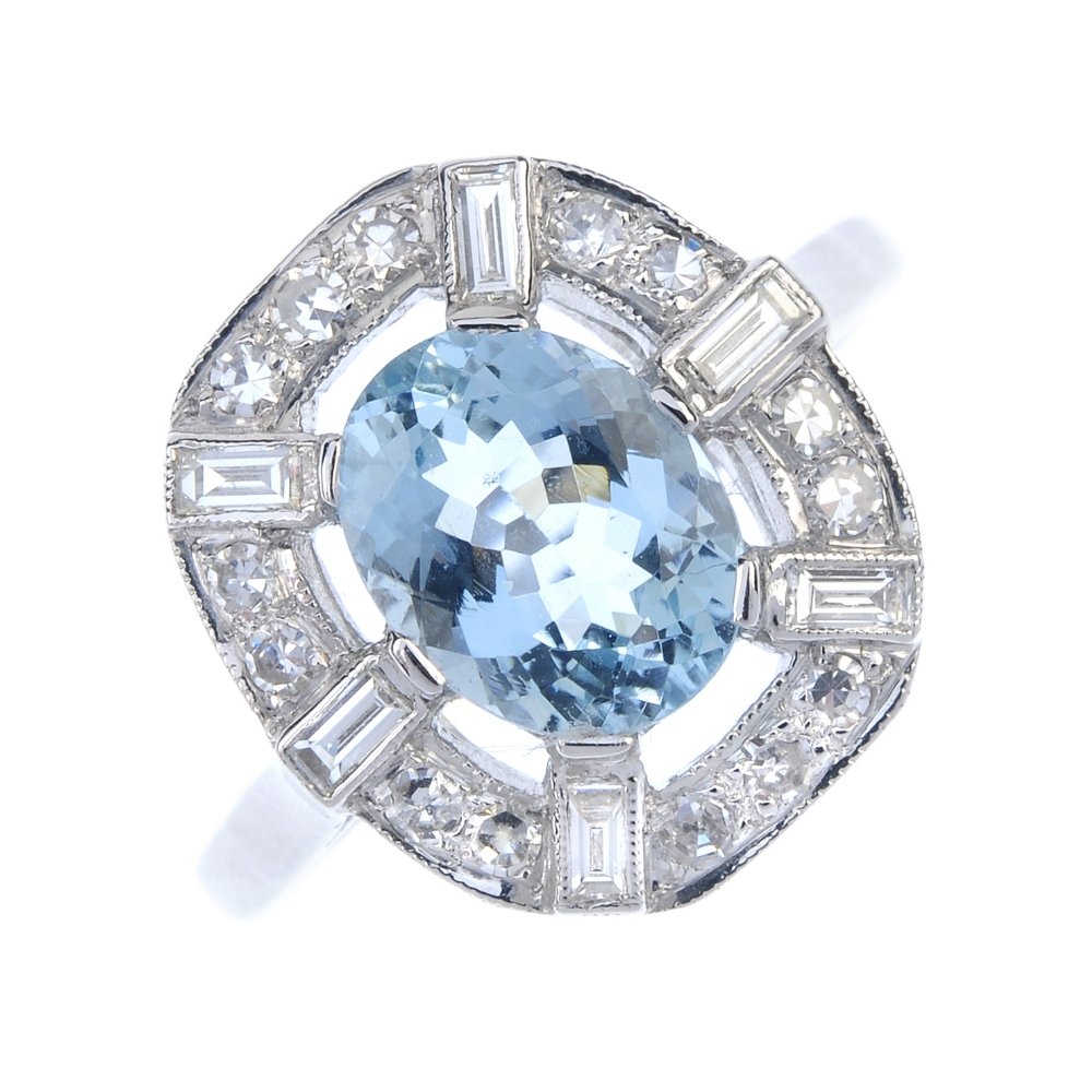 An aquamarine and diamond cluster ring. The oval-shape (1 of 3)